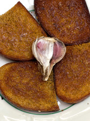 fried bread with garlic on a white plate