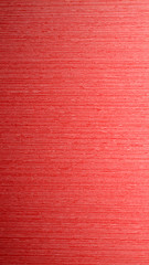 Brightly red background with texture.