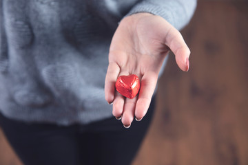 woman hand candies heart