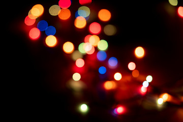 abstract colorful bokeh lights of garland on the party celebration