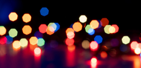 abstract colorful bokeh lights of garland on the party celebration, wide banner