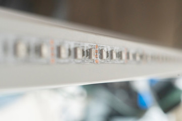 macro view of the turned off led strip light installed on the furniture at home