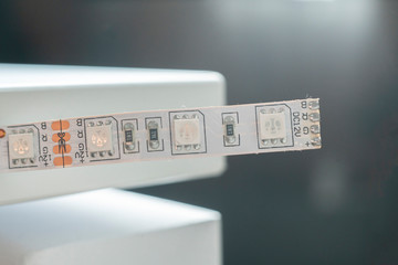 macro view of the turned off led strip light installed on the furniture at home