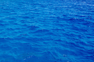 Fototapeta na wymiar a piece of beautiful red sea close-up. The deep blue color of the sea. Background from sea water