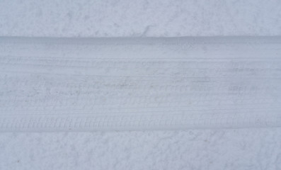 car wheel trace texture on the winter surface outdoor on the race track