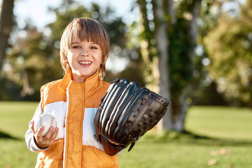 Preparing your kid. Little boy is ready to play baseball