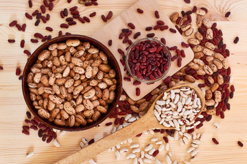 Haricot grains of different varieties: white, red, brown, spotted, large and small. Vegetarian food containing a large amount of vegetable protein, vitamins of group B.