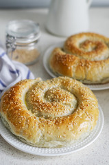 Puff with sesame seeds. Spinach and Puff Pastry Cheese Snail