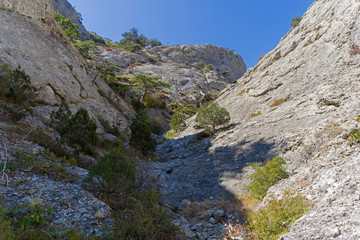 Riverbed pierced in the stone by rain and melt water. Crimean mountains.