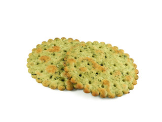 Round crispy cracker with herbs, two pieces closeup isolated on white background side view