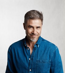 Fototapeta premium Goodlooking older man in casual shirt smiling