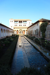 Cosy court of la Acequia with fountains and pool in generalife palace, Alhambra, Granada, Spain