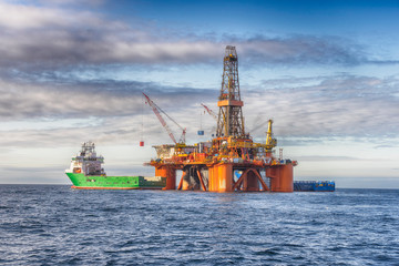 Supply vessel during operation along side with a drilling rig