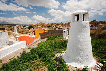 Old Cave houses in Guadix, Andalucia, Spain. Up to 10,000 people still lie in cool underground houses dug out of the rock, this area known as the Barrio Santiago is a mix of modern cave house