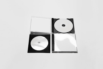 Open and close compact plastic disc box case set with white isolated blank for branding design. CD jewel mock-up on soft gray background. DVD or CD disc