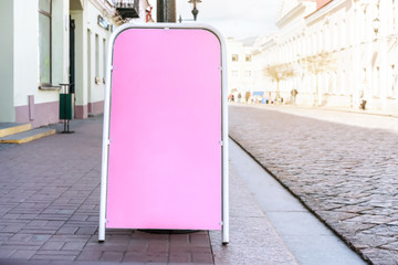 advertise sign with empty place for message stands on sidewalk