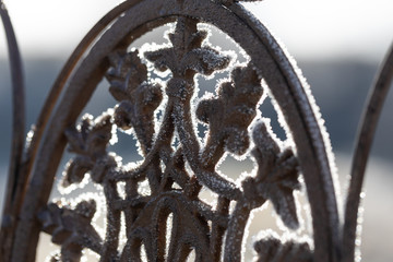 detail of a garden chair wiht hoarfrost