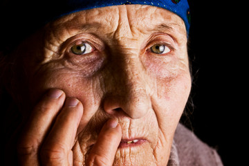 Grandmother's eyes close-up. The wrinkled face of an old mother. Aged face from unrest. Youth is leaving, an older woman close-up. Grandmother portrait photo. Mother. Female. Grandmother. Take care of
