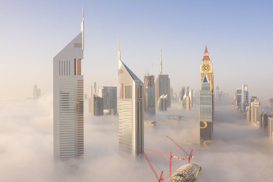 Aerial view of buildings surrounded by clouds, Trade Center 2, Dubai, United Arab Emirates