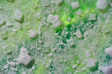 Salt crystals at the bottom of the dishes. Highlighted in green using a smartphone.