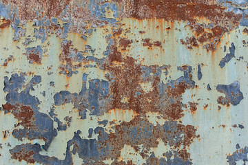 Rusty background. Old rusty metal sheet. rusted wall of the garage. Brown background. Grunge texture.