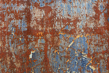 Rusty background. Old rusty metal sheet. rusted wall of the garage. Brown background. Grunge texture.