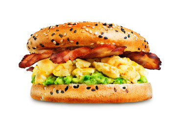 Fried bacon avocado cheese egg salad  bagel on a white isolated background