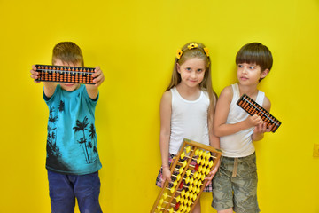 a girl with a wreath on her head and children and an abacus,