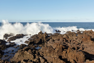 View of the ocean waves on the coast of the Canary island on a summer day