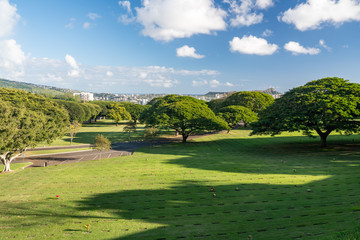 Open grass in the National Memorial Cemetery of the Pacific in punchbowl crater on Oahu, Hawaii