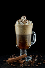 Festive mocha coffee with hot chocolate, vanilla ice cream, whipped cream and cinnamon