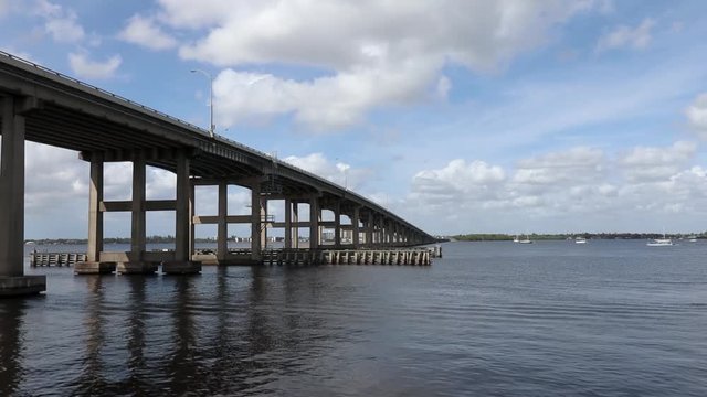 Landscape of the Edison bridge going over the Caloosahatchee River this bridge connects Cape Coral to Fort Myers Florida shot from centennial park peir
