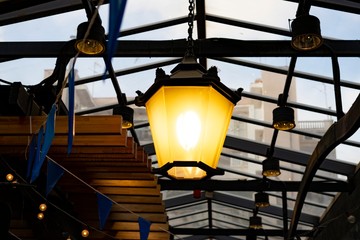 Light bulb lit in a modern house.