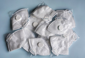 A lot of medical face dust masks, disposable FFP3 respirators protective mouth filter mask. Concept...