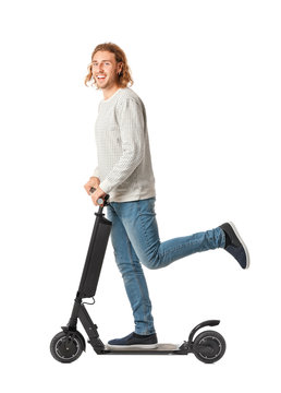 Young Man With Kick Scooter On White Background