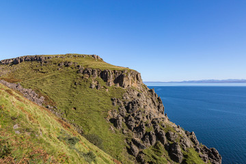 Fototapeta na wymiar The rugged coastline of the Isle of Skye with a clear blue sky overhead