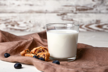 Sweet cookies and milk on table