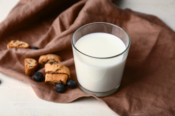 Sweet cookies and milk on table