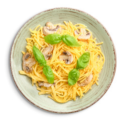 Plate with tasty pasta and mushrooms on white background