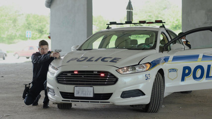 Dangerous situation two policemen leave the patrol car pulling pistols danger delinquent gangster gun gunpoint handgun hold illegal intruder law offender burglar teamwork close up © Fractal Pictures