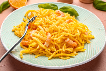 Plate with tasty pasta and shrimps on table, closeup