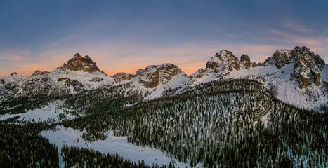 An incredible sunset in the Dolomites Alps in the Tre Cime di Lavaredo national park in january 2020 in Italy. Aerial drone panoramic shot