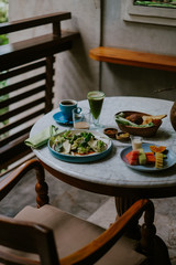 Table breakfast setting on the balcony in the jungle