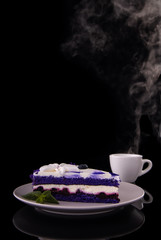  lavender cake and a cup of tea on a black background for the menu