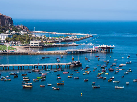 Boats in Chorrillos, with Regatas social club as background in Lima, Peru