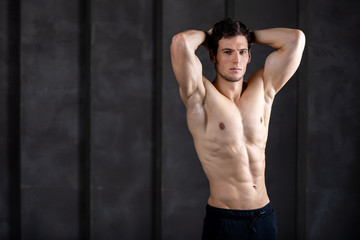 Fototapeta na wymiar Strong man fitness model. Bodybuilder.