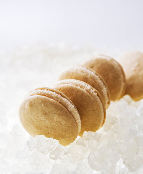 Row of macaroons on crushed ice