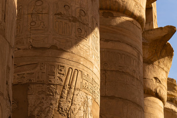 Karnak Temple, complex of Amun-Re. The large courtyard of the temple of Amun. Embossed...