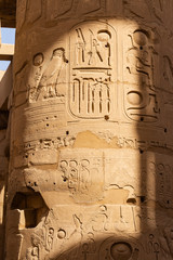 Karnak Temple, complex of Amun-Re. Embossed hieroglyphics on columns. Great Hypostyle Hall. Columns...