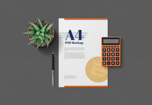 Stationery with Calculator, Plant, and Pen Mockup